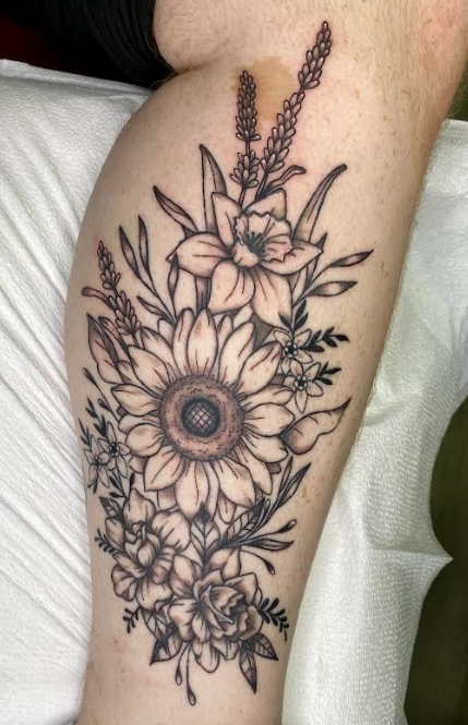 Fine linework devil cherub with bat wings and a trident on a forearm
